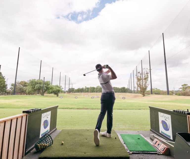 Curlewis_Range_Driving Range man on a driving range hitting a golf ball
